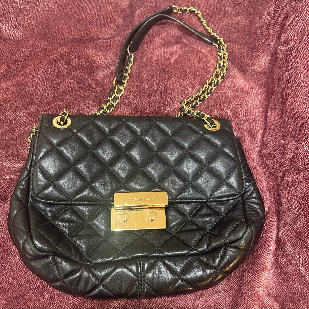 Michael Kors larger quilted black flap bag
